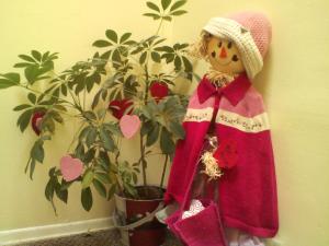 Meet Rosie. She's our scarecrow that we got on clearance two years. She sits in the hall outside our door. We decided that we liked her so much that we keep her out all year long and dress her up for each holiday/season. The kids say hi and bye to her each day.