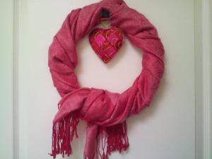 Valentine's wreath on our door made from a scarf wrapped on a round frame.