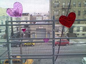 Sticky hearts from the .99 Cent store in the window - It's Valentine's Day NYC!