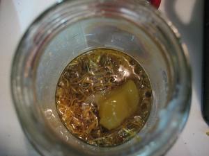 tallow and lanolin melting and herbs infusing